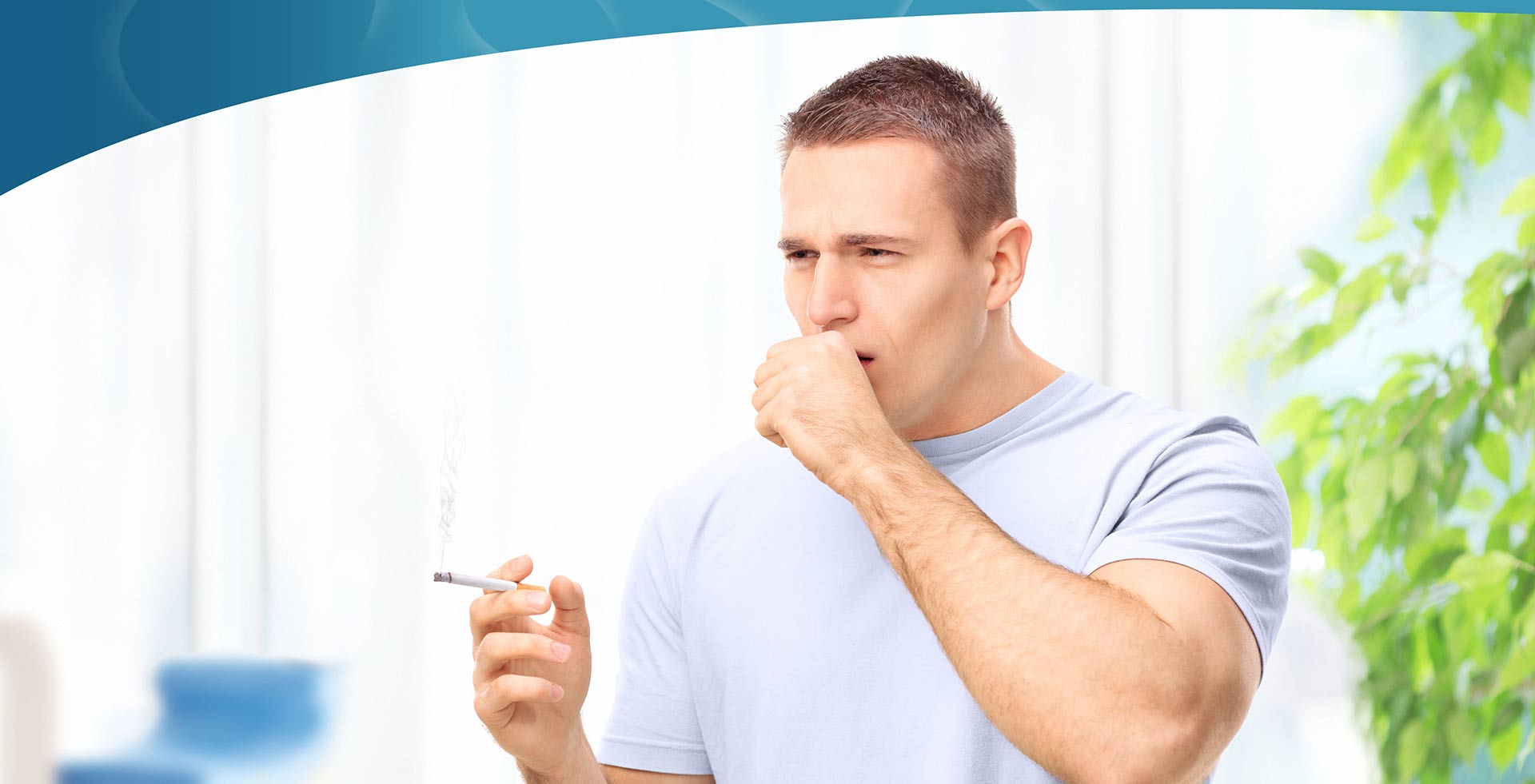 A man holding his cigarette and cough at the same time